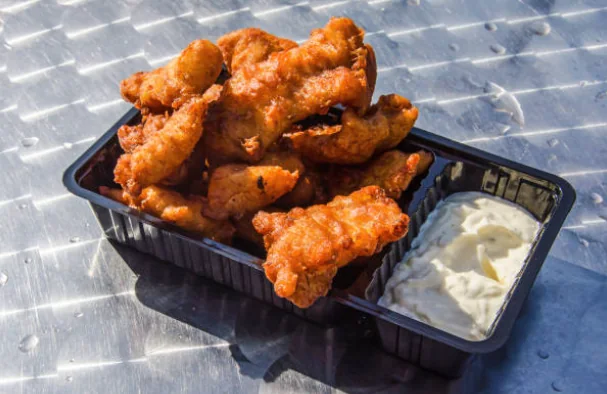 Freshly fried kibbeling served with a creamy dipping sauce