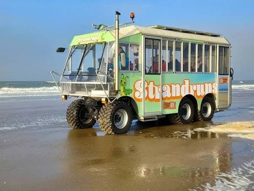 Strandrups accessible beach vehicle driving along the shoreline at Langevelderslag Noordwijk